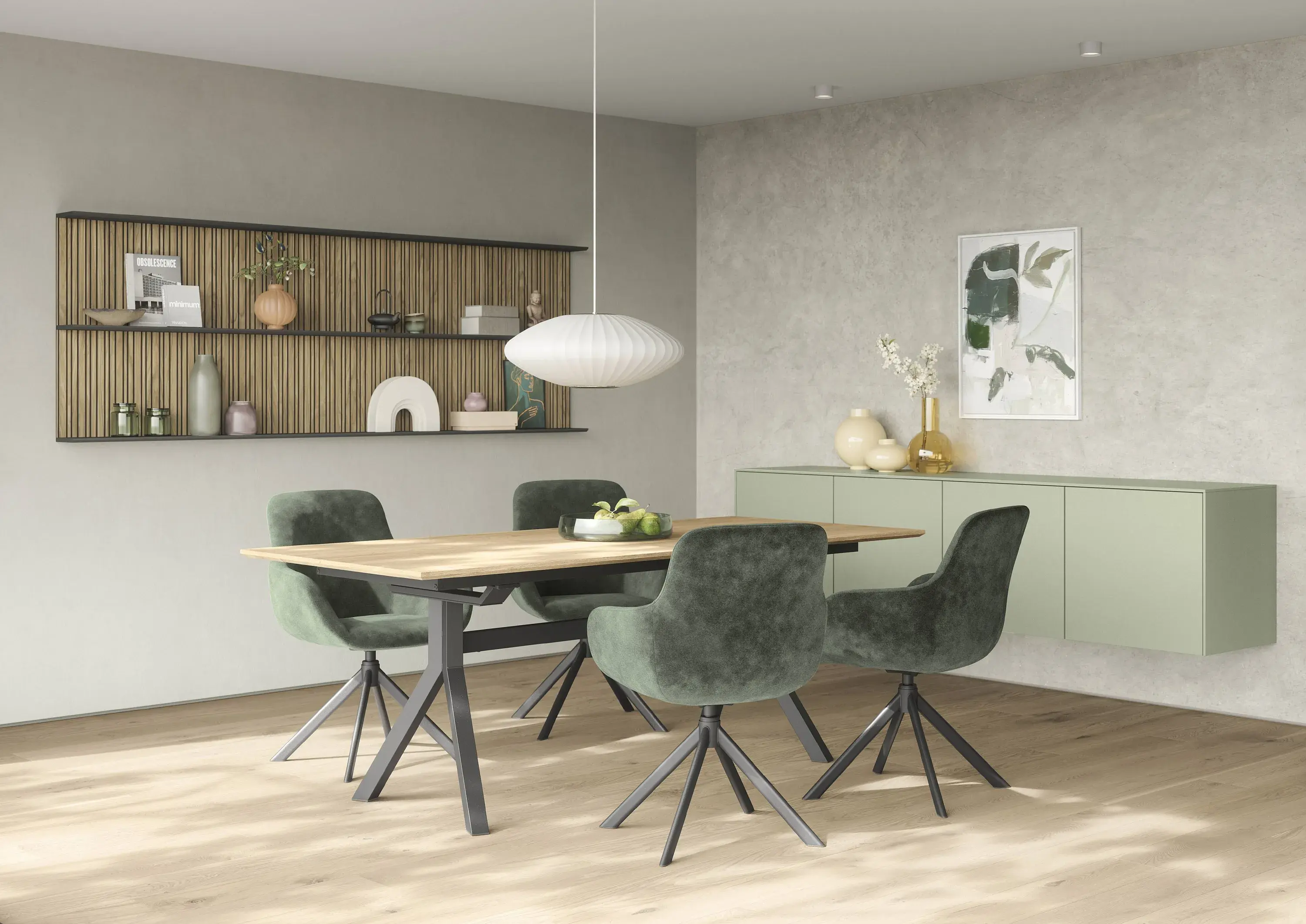 4 graue Dreh-Polsterstühlen an einem Esstisch mit Holzplatte und schwarzen Metallbeinen weiße Pendelleuchte - an der Wand ein schilfgrünes Hänge-Sideboard Nobilia Artis